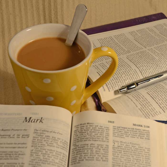 Bibles with coffee cup